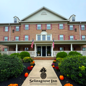Picture of the Selinsgrove Inn with pumpkins lining the sidewalk toward the front door of the Inn.