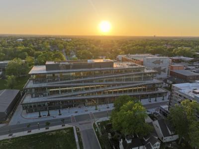 An aerial view of Ledger with the sun setting in the distance