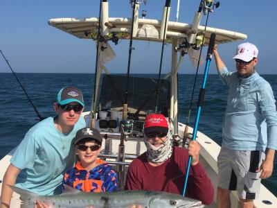 Holding a barracuda - fun family fishing with Capt. Van Hubbard -