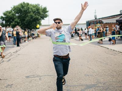 Winner crosses the finish line of the Four Peel Fest 0.5K
