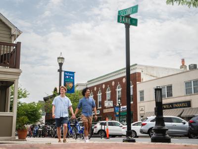 A couple walking through downtown Lewes.