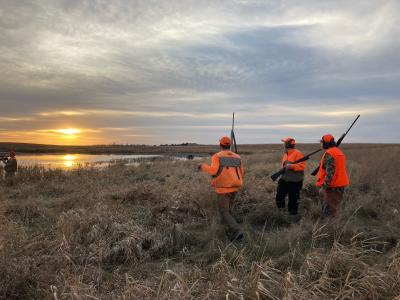 three men upland game hunting