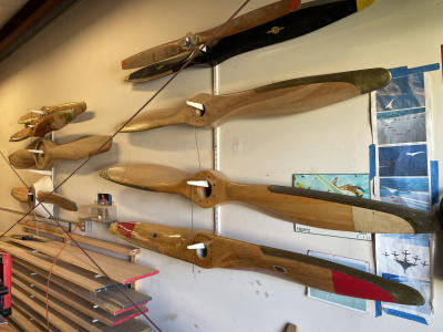 Custom wooden propellers displayed on the wall