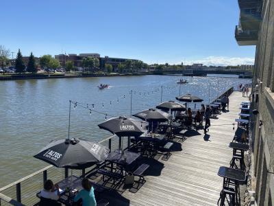 Waterfront Wine Bar outdoor seating with manitowoc river