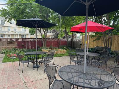 kc kitchen and cocktails outdoor patio with umbrellas up