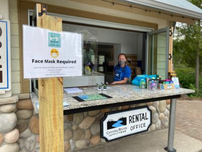 The new socially distanced sign-in being manned by Morgan Taylor at Crystal River Outfitters