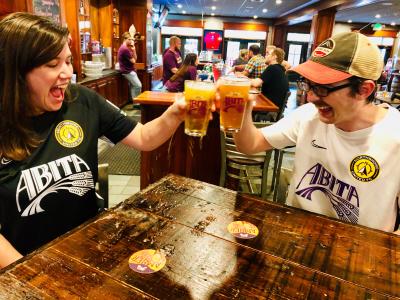 Abita Brewery, couple toasting at taproom
