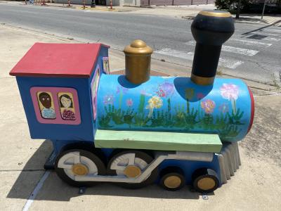 “Next Stop: Children’s Museum” by Lee Evans, Valerie Fore, Susan Chandler, Elizabeth Evans, Kate Evans, Emma Fore, Lydia Huffines, Patrick Chandler, and Owen Chandler. Located at the corner of Central Ave and 3rd Street.