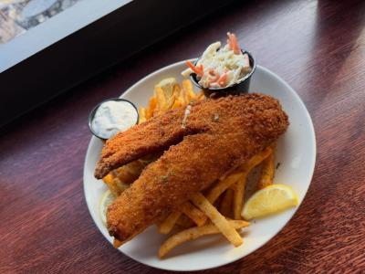 Walleye fish special plated with French fries, coleslaw and tartar sauce
