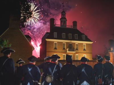 Colonial soldiers watching fireworks go off on the 4th of July