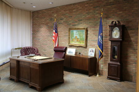 President Gerald Ford's desk, clock, flags, and other paraphernalia in his office at the Gerald Ford Library