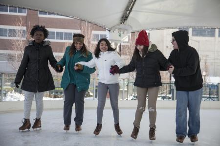 A group of people skating at the MetroParks Ice Rink at RiverScape
