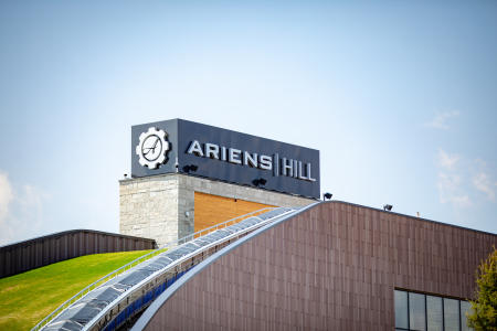 Ariens Hill Sign and part of the grassy hill at Titletown in Green Bay, Wisconsin.