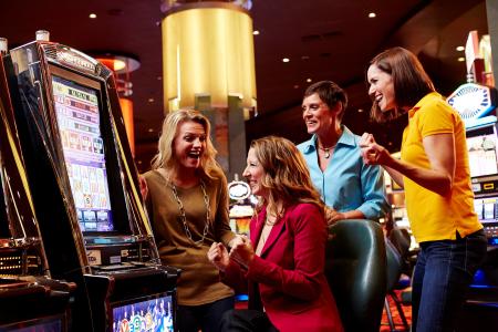 Group of four women playing a slot machine at Oneida Casino