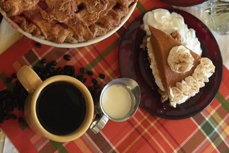 Pumpkin dessert with cup of coffee at Bread Basket Cafe & Bakery