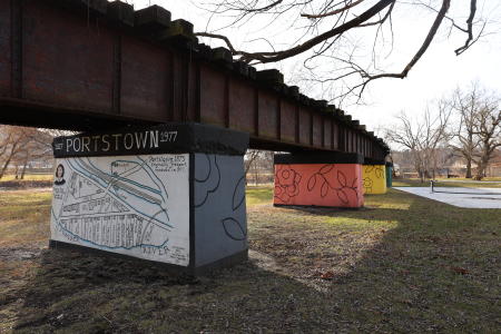 view of the murals on the old train trestles at Portstown Park, Huntingdon