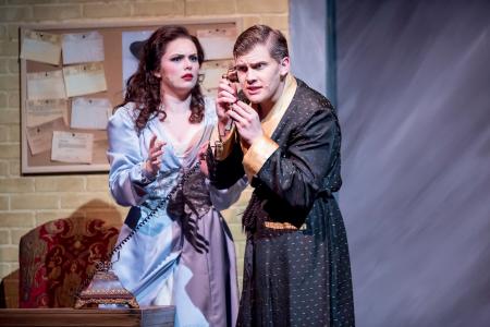 northern kentucky university theatre production photo of man holding phone and woman with puzzled look on her face