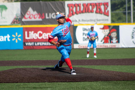 pitcher throwing a pitch from a pitcher's mound at a Florence Y'alls baseball game in florence ky