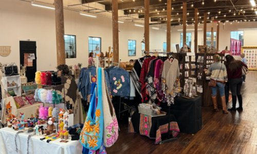 display of handmade purses, jewelry, clothing and more