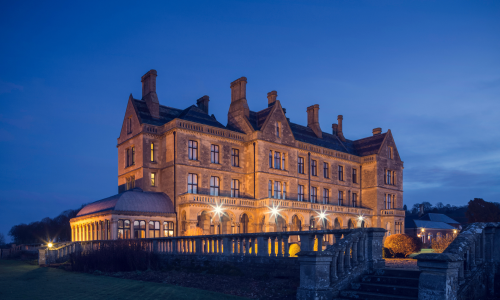 An evening exterior image of Walton Hall