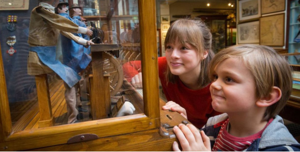 Two children look at an exhibit at Whitby Museum