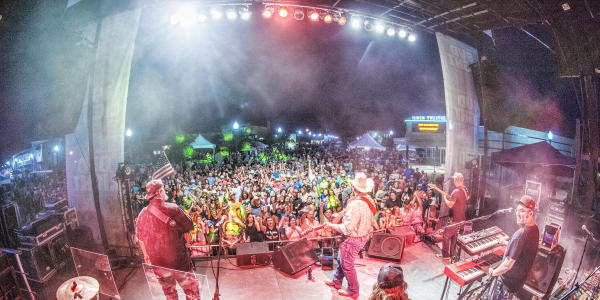 crowd watching band on stage