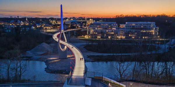 The Dublin Link pedestrian bridge lit red white and blue at night