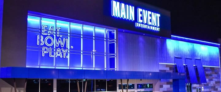 Neon signage invites guests to enjoy the indoor space at Main Event in OKC.