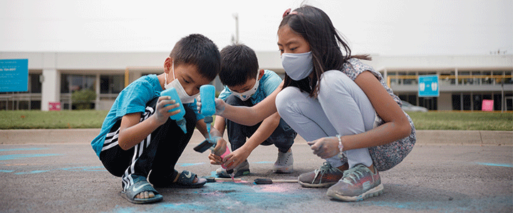 Kids wearing masks and creating art outside of Oklahoma Contemporary Arts Center