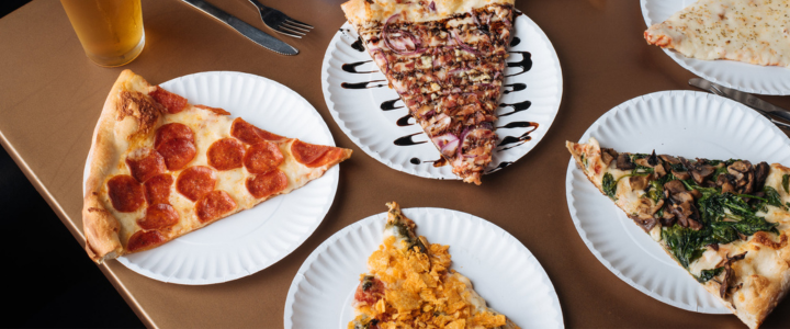 Table of pizza slices at Empire Pizza