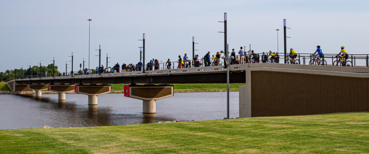 Group of people walking on Pedestrian Bridge over Oklahoma River