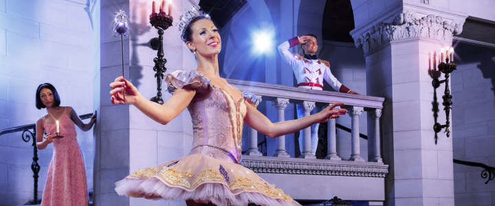 The cast of OKC Ballet's The Nutcracker in costume on stage.