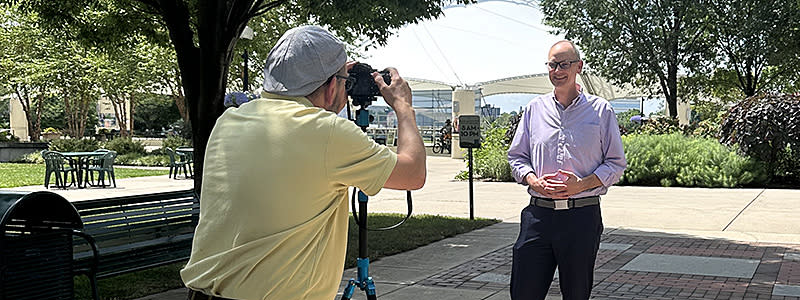 Destination Dayton President John Oney being interviewed at RiverScape MetroPark.