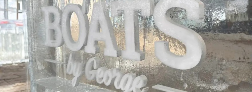Boats by George sign carved from ice