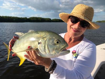 Fishing: woman holding Crevalle Jack