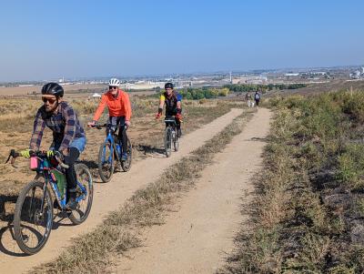 Three cyclists are biking on the Shurview bike path