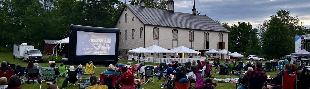 People watching a movie outdoors at the park at Fort Hunter in Harrisburg, PA