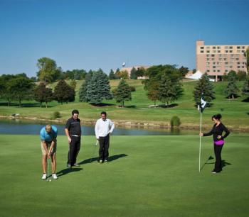 Group of four on the putting green at Eagle Crest