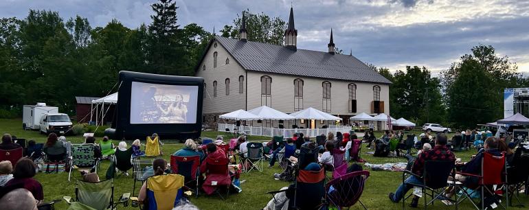 People watching a movie outdoors at the park at Fort Hunter in Harrisburg, PA