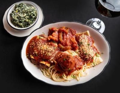 A plate of ravioli and spaghetti noodles smothered in tomato sauce and topped with parmesan at Taliano's Italian Restaurant, Fort Smith Arkansas.
