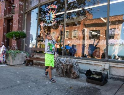 child playing outside sunrise soap company