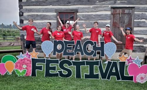Peach Festival sign with Mt. Airy staff
