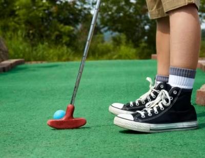 Kid putting at Putt Putt Fun Center
