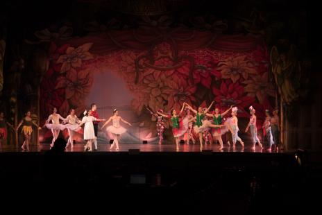 many ballet dancers on stage