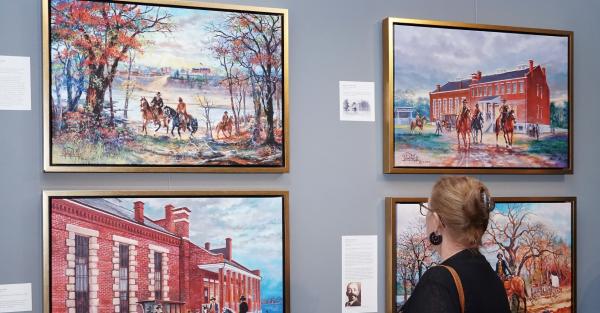 Women viewing John Bell paintings