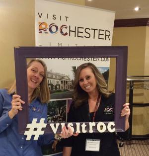 Visit Rochester Staff show off their Rochester pride at the Roc to Albany Tradeshow event