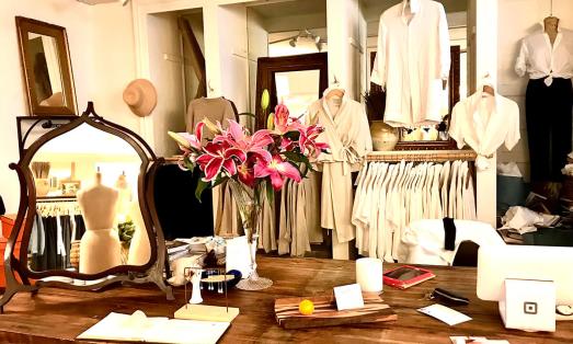 Women's clothing on racks in a boutique store in downtown McKinney.