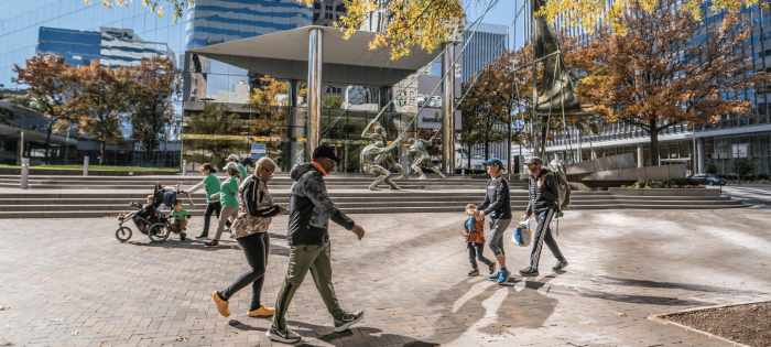 People walking by the Bank Of America Financial Center
