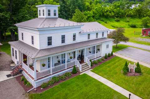 This renovated 1880 farmhouse boasts country charm with modern amenities.