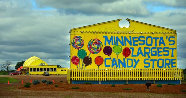 Large yellow barn that is a candy store